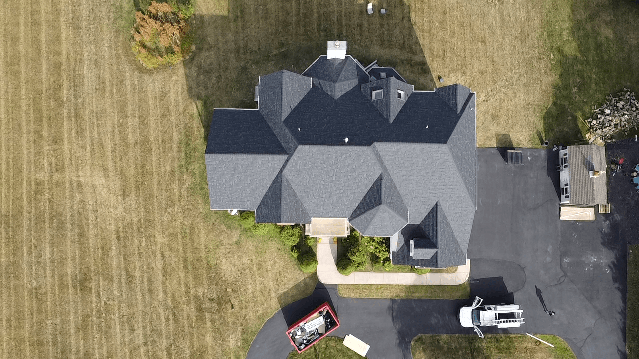 Overhead drone view of completed mansion roof replacement